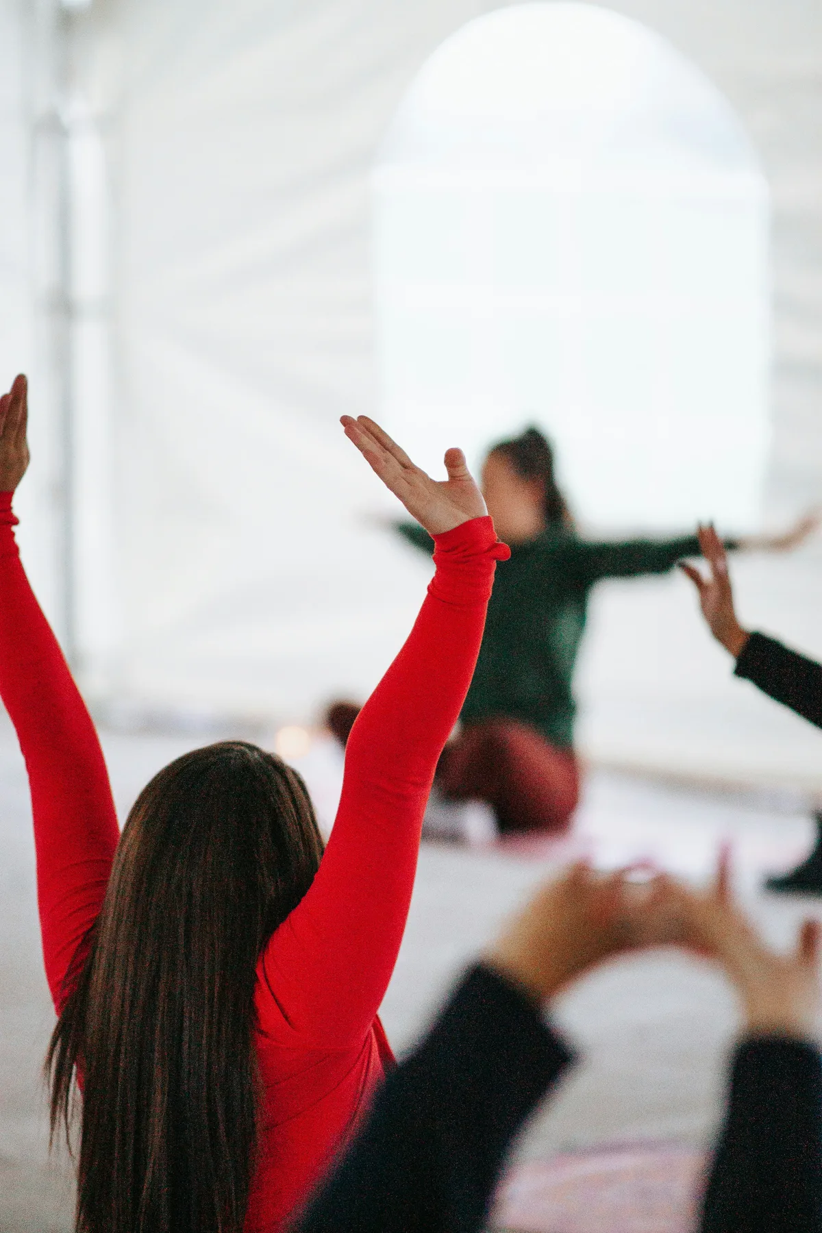 A group of employees during a stretching and wellness session at work