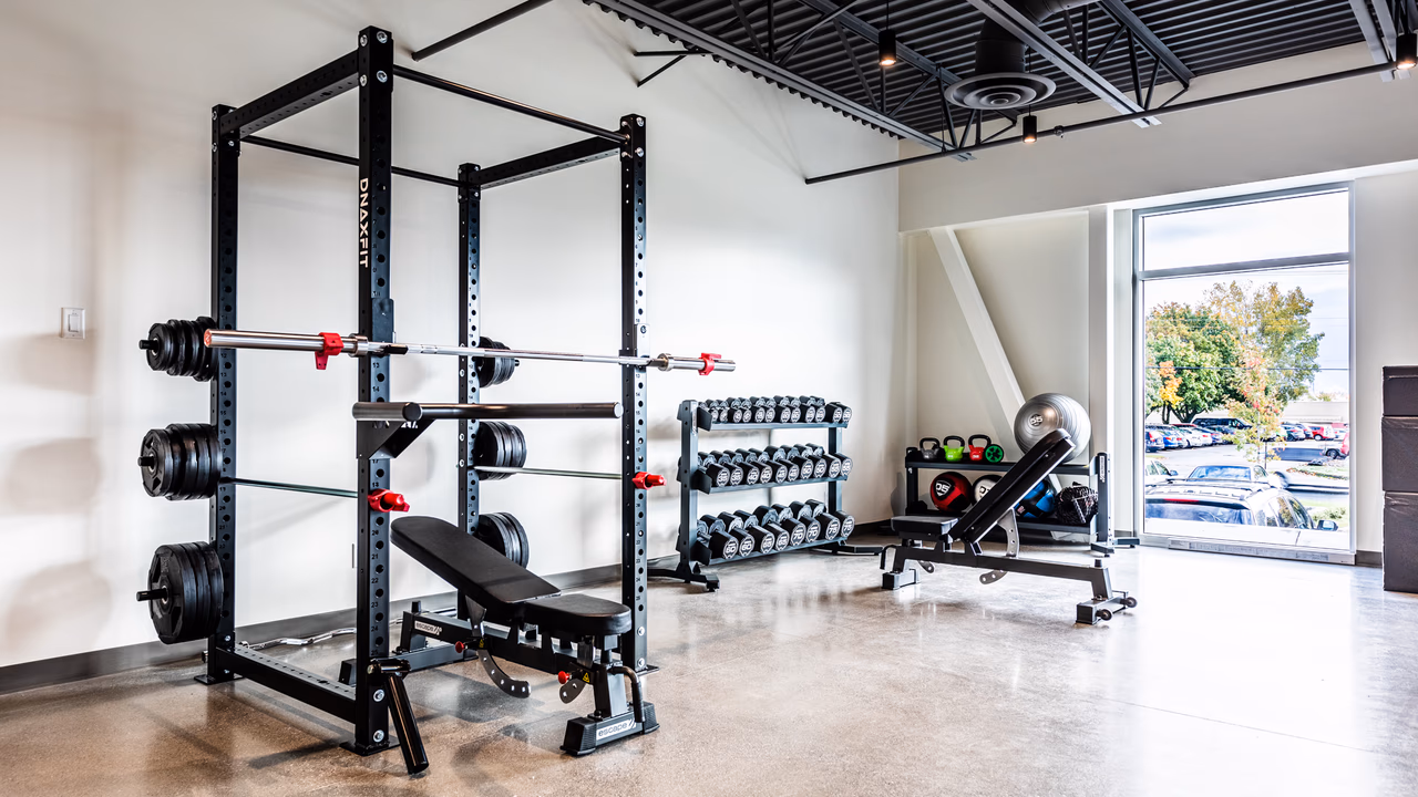 Archer corporate gym in Granby with a DNAxFIT rack and free-weight area.